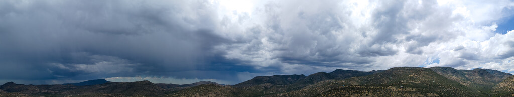 Storm clouds over a sunlit Davis Mountains ridge