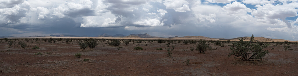 Storm clouds crossing a red desert plain near Fort Davis