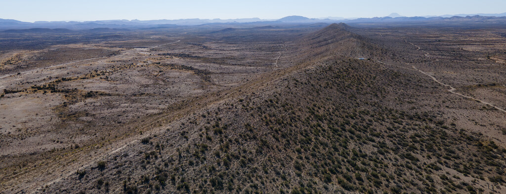 Rocky ridge crossing a broad desert basin